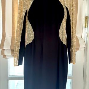 Black cocktail dress with silver beaded arms and down the sides of the dress